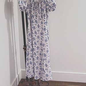 Beautiful white midi dress with blue flowers. Worn once. Perfect condition.